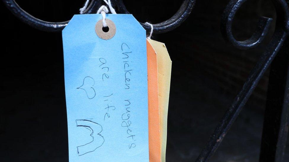 A sign hung on the door of a church in Bletchley reads: "Chicken nuggets are life" with a heart-shaped symbol