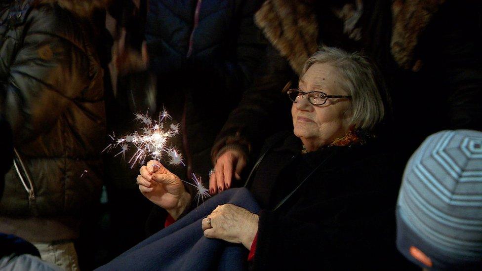 Woman with sparkler in Stein