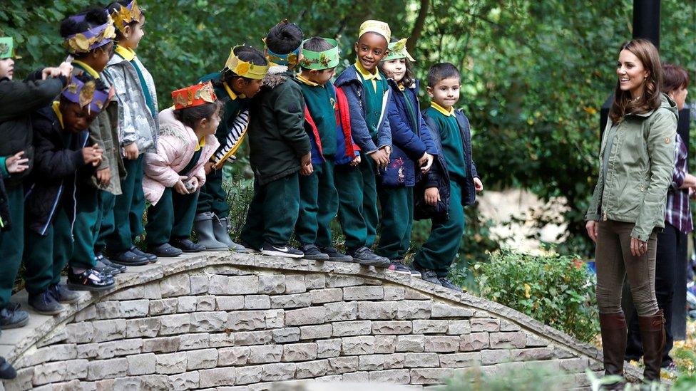 Kate with schoolchildren