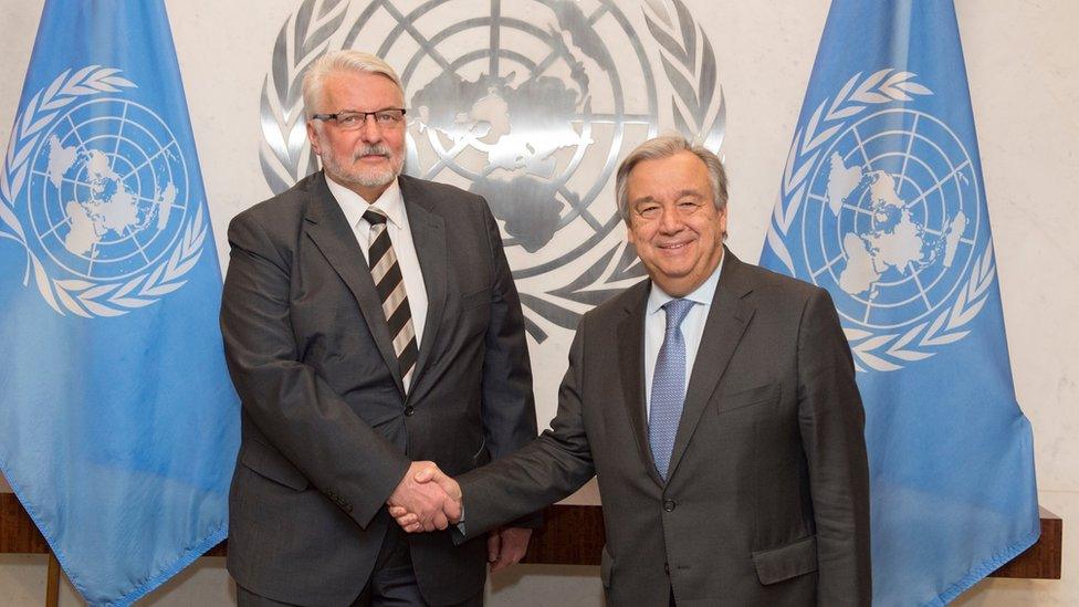 In this photo provided by the United Nations on Monday Jan. 9, 2017, U.N. Secretary-General Antonio Guterres, right, and Poland"s Minister for Foreign Affairs Witold Waszczykowski, left, pose for a handshake during their meeting at U.N. headquarters.