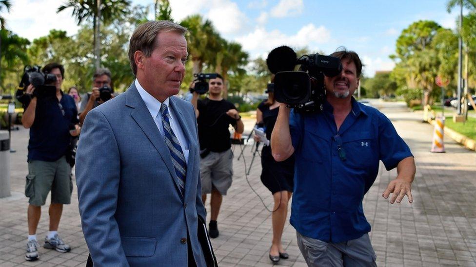 Tiger Woods' lawyer appears outside court