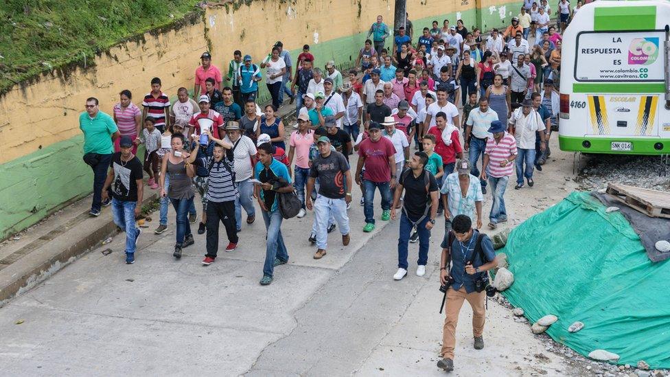 Isabel Zuleta leads a group of people protesting against the dam