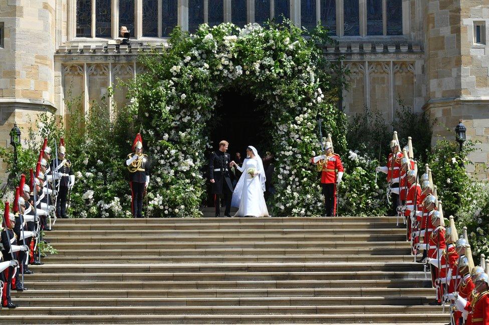 Prince Harry and Meghan Markle leave St George's Chapel in Windsor Castle after their wedding