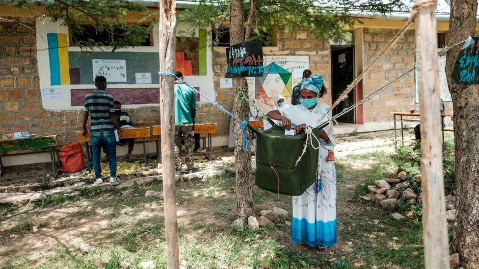 A woman casts her ballot at a polling station during Tigrays regional elections, in the town of Tikul, 15 kms east from Mekele, Ethiopia, on September 9, 2020.