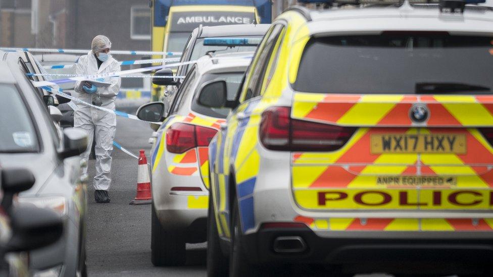 Police forensics teams working in Summers Street in Swindon