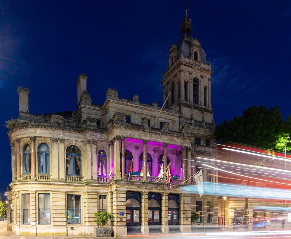 A building in Newham lit up purple