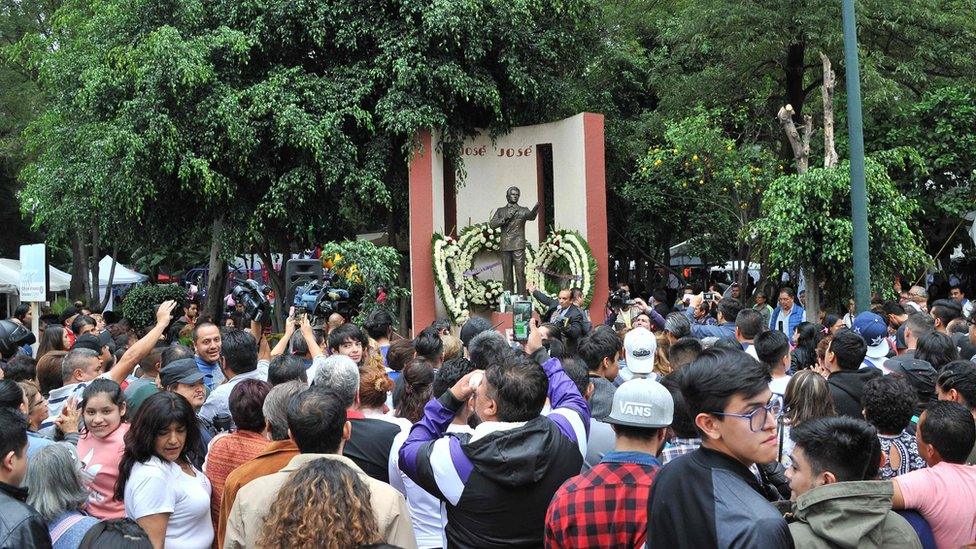 Fans pay tribute to José José in front of his monument in Mexico City