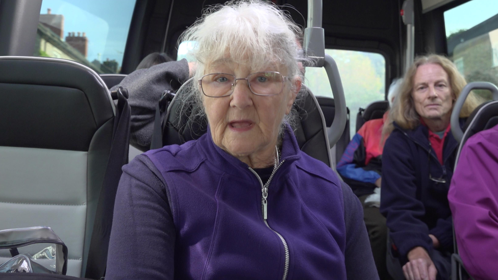 Shirley sitting on the bus