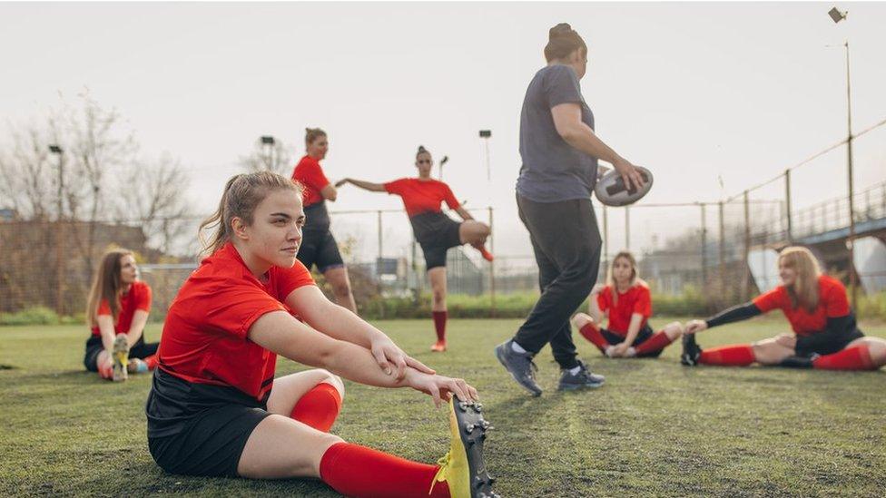 Sports team on rugby pitch