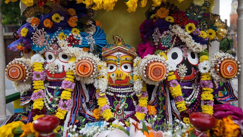 Festival-goers pull a 40ft chariot through Leicester