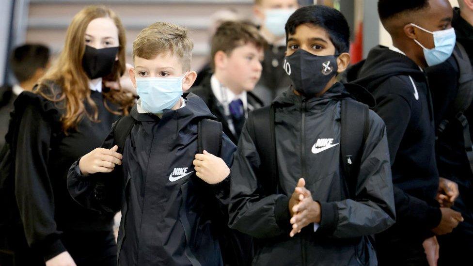 school children wearing masks