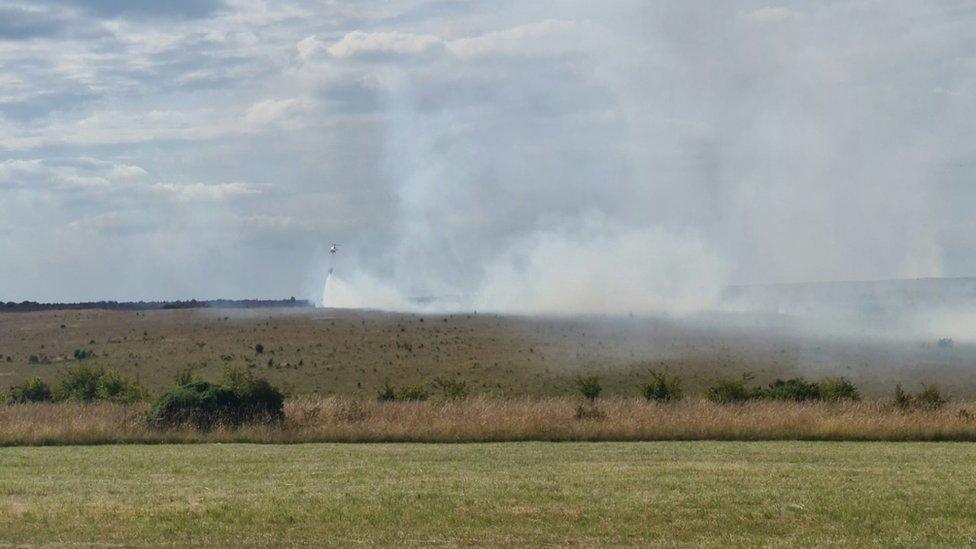 Helicopter putting out fire