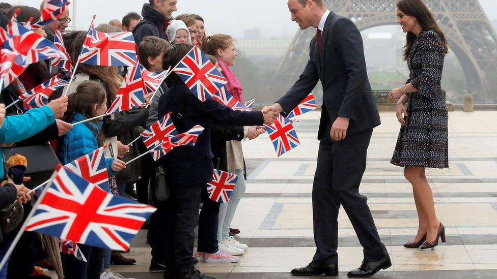 The Duke and Duchess of Cambridge in front of the Eiffel Tower