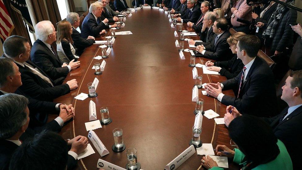 Donald Trump presides over a meeting of congressional legislators