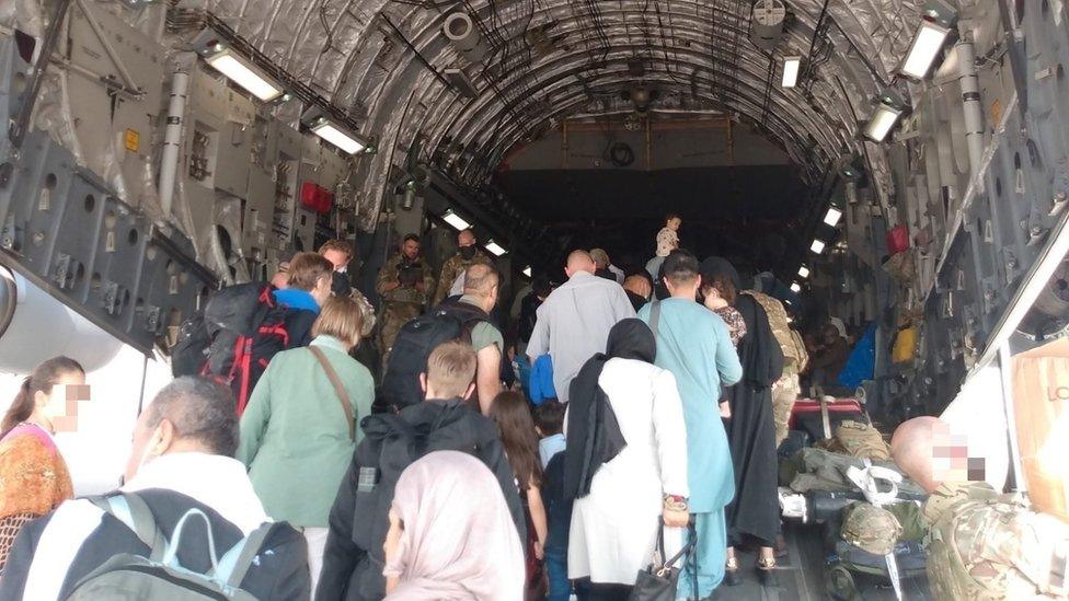 People on an RAF evacuation flight