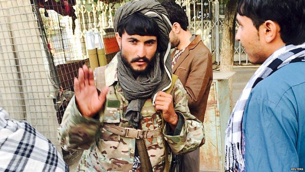 A Taliban fighter on the streets of Kunduz