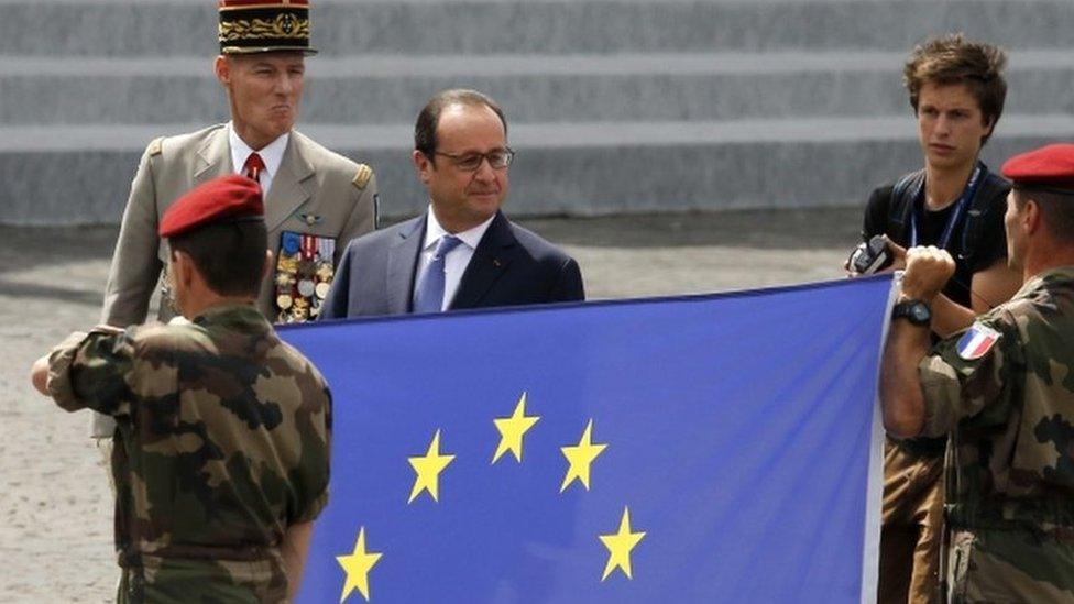 Francois Hollande reviews troops as part of Bastille Day celebrations (14 July)