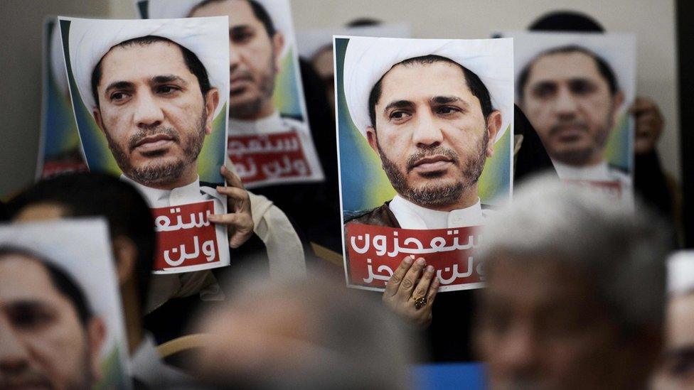 Wefaq supporters hold up posters of Sheikh Ali Salman at a protest in Zinj, Bahrain (29 May 2016)