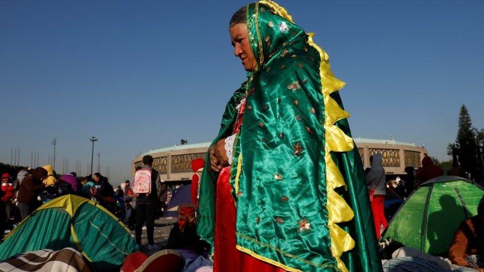 A pilgrim dressed up as the Virgin of Guadalupe is seen at the Basilica of Guadalupe during the annual pilgrimage in honor of the Virgin of Guadalupe, patron saint of Mexican Catholics, in Mexico City, Mexico December 12, 2017.