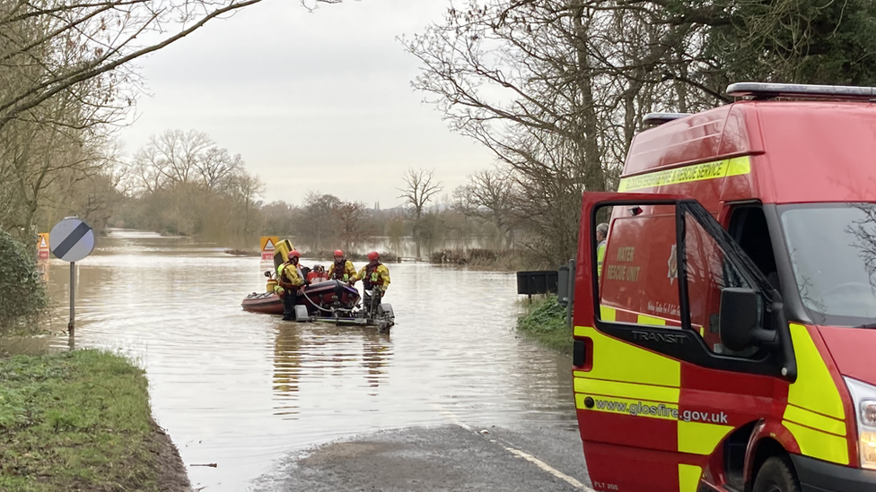 People being rescued from flooding