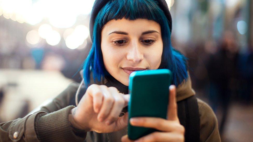 A woman using a mobile phone