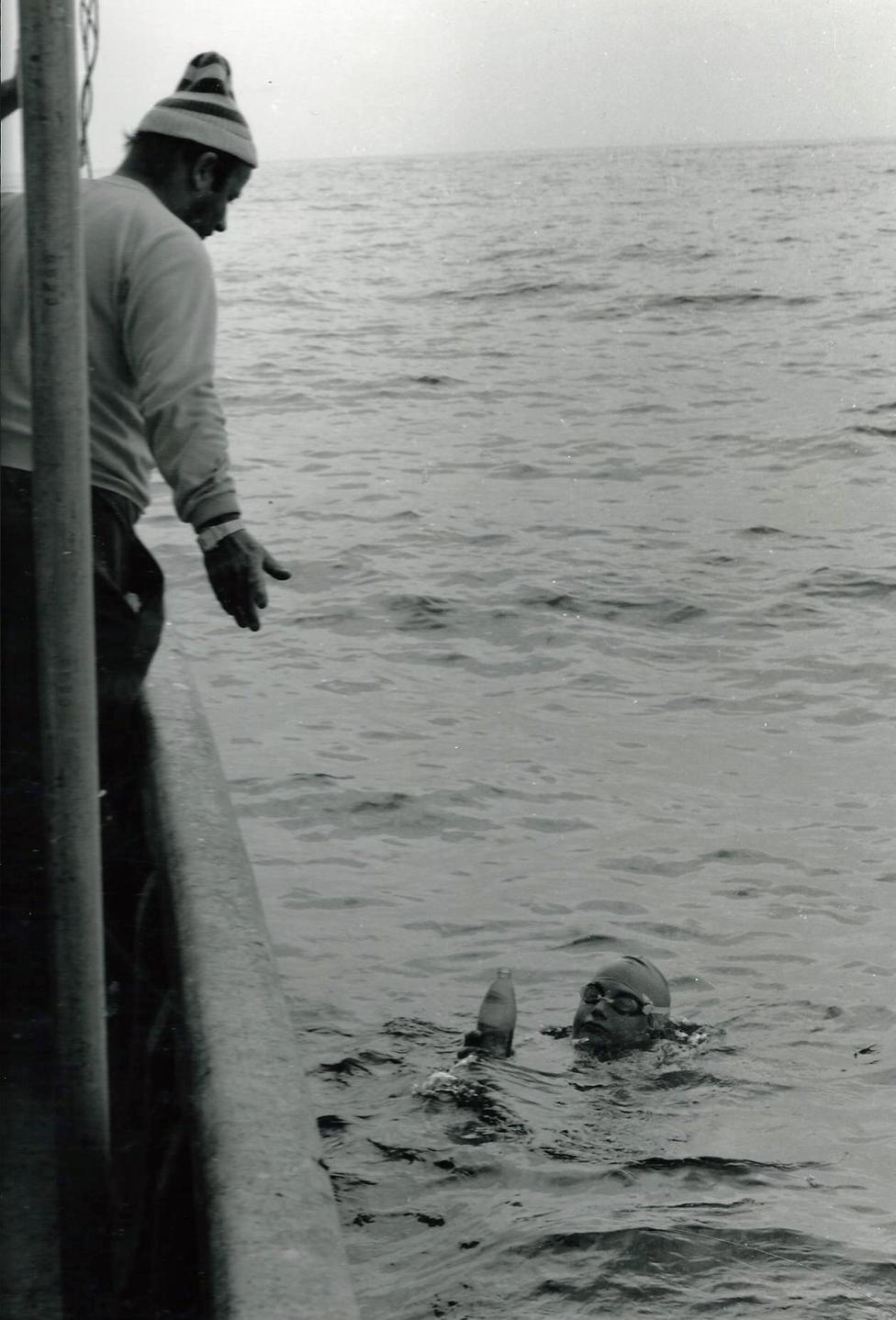 John Bullet looks down on Tom Gregory as he swims the channel