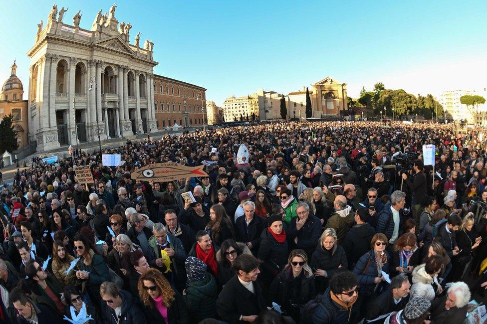 People take part in the "Sardine Movement" rally in Rome, 14 December