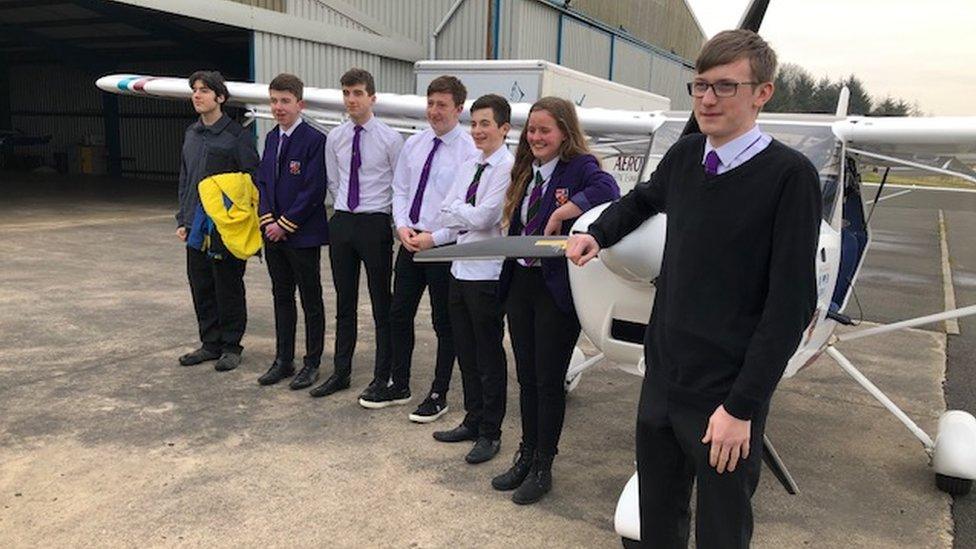 Students with plane