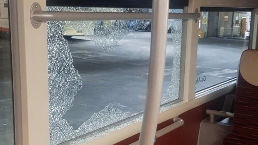 Smashed bus window