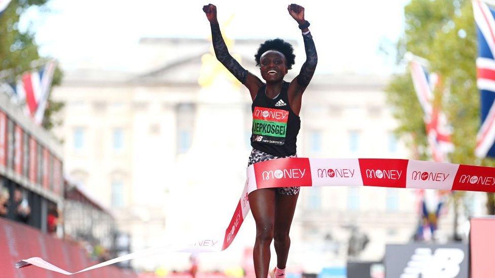 Joyciline Jepkosgei of Kenya celebrates winning the Women's Elite Race