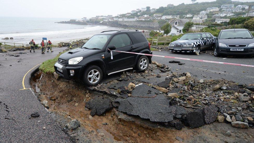 Part of a car park washed away