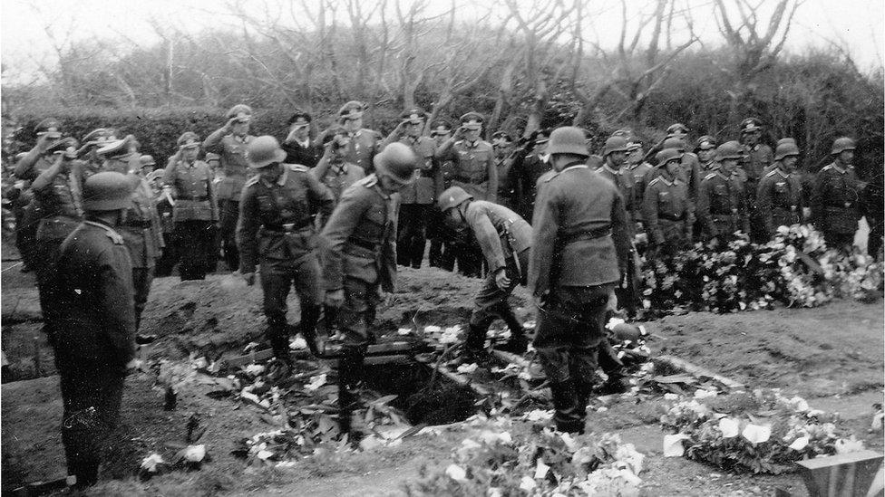 Fallen comrade lowered into the ground in Guernsey