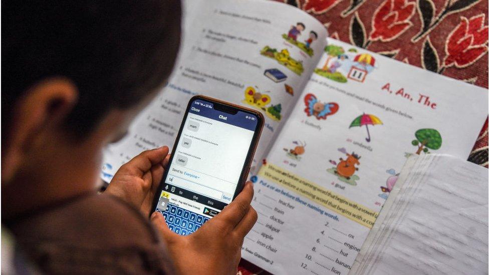 A child attends an online class on Zoom