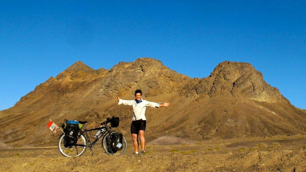 Sarah cycling the Gobi desert