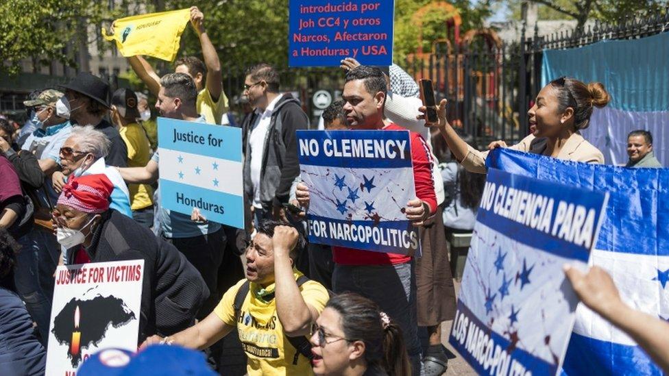 People gather in front of the United States federal courthouse where former Honduran president Juan Orlando Hernandez