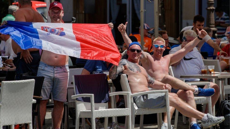 Rangers fans gather at a bar in central Seville