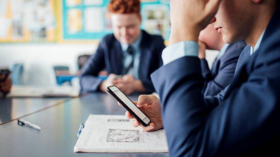 School pupils using phones