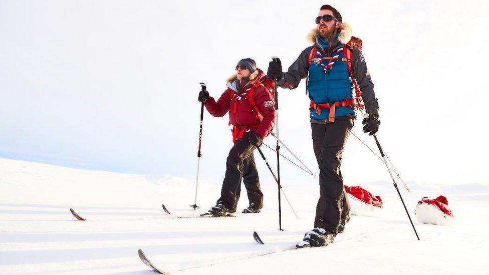 Joe Doherty (near) and Oliver Robinson (far) skiing in the snow