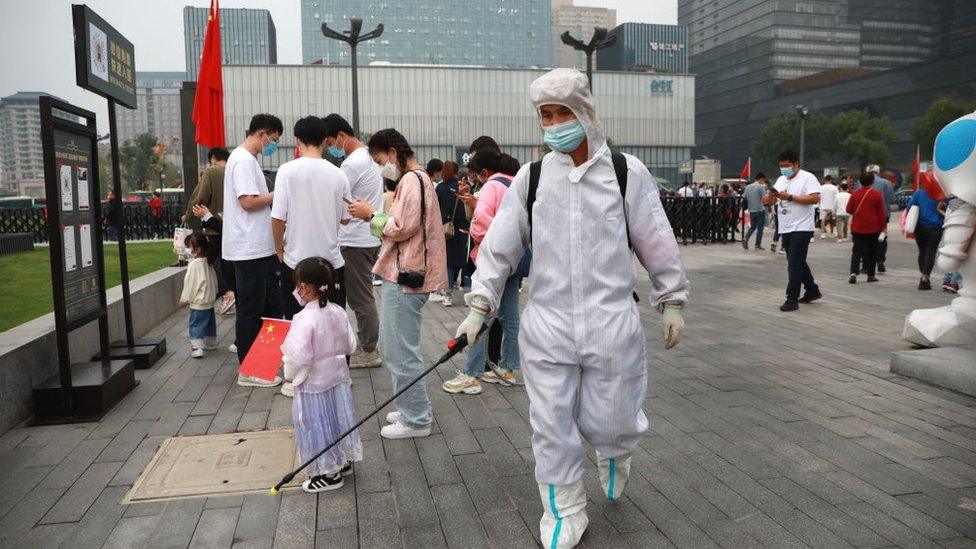 worker disinfects site in Xi'an