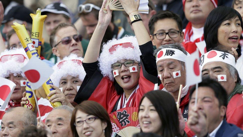 Japanese rugby fans celebrate the 34-32 win against South Africa in Brighton