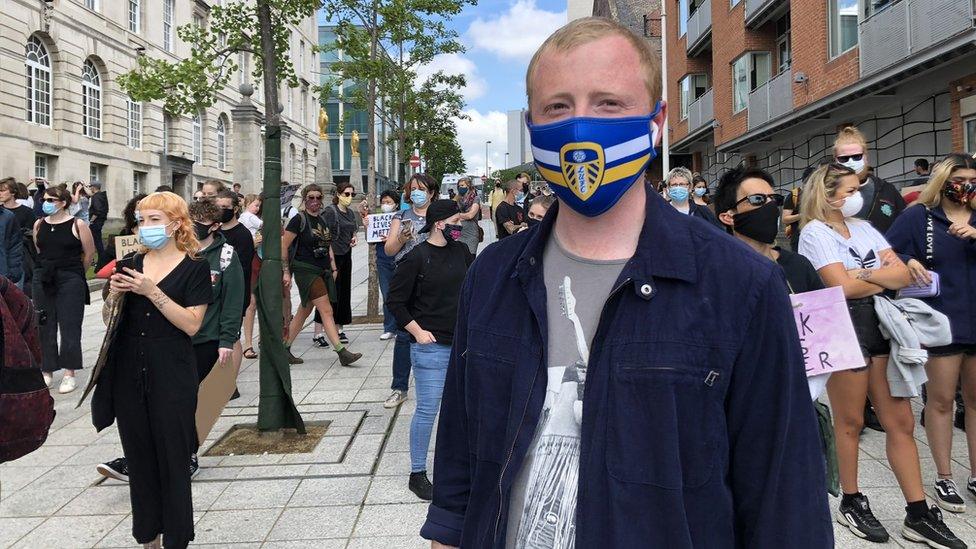 Protesters wearing face masks