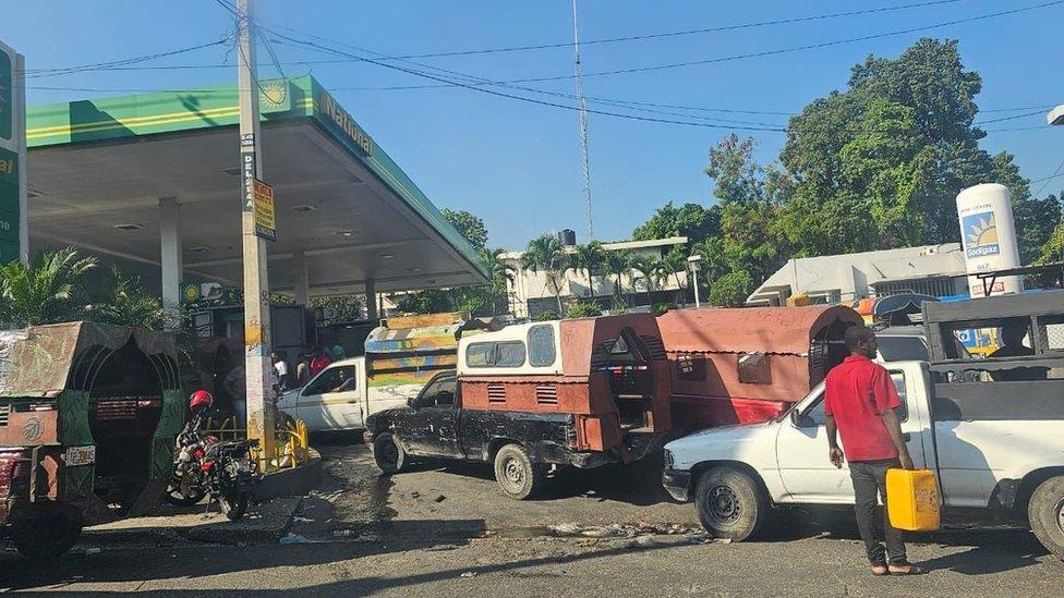 Cars queueing at a petrol station