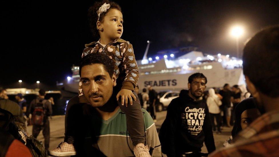 Syrian refugees disembark a ferry at the port of Piraeus, near Athens, Greece, 01 September 2015.