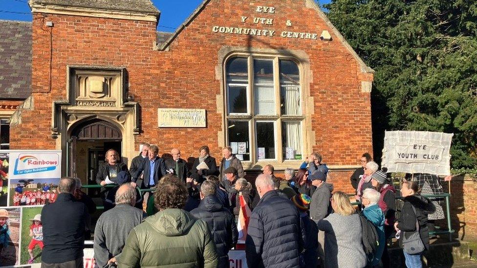 Residents outside the community centre