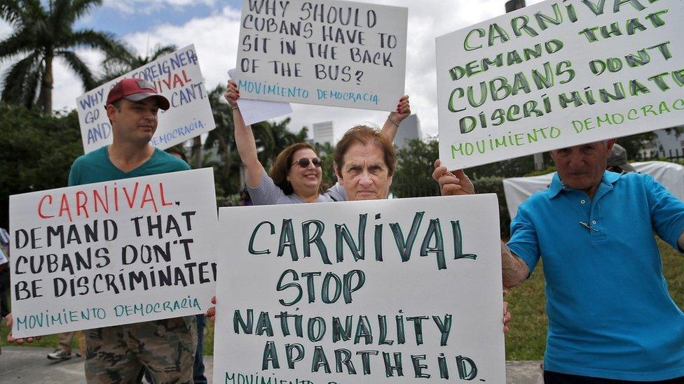 Protesters demonstrate against cruise operator Carnival after it emerged people of Cuban origin could not board their cruise to Cuba