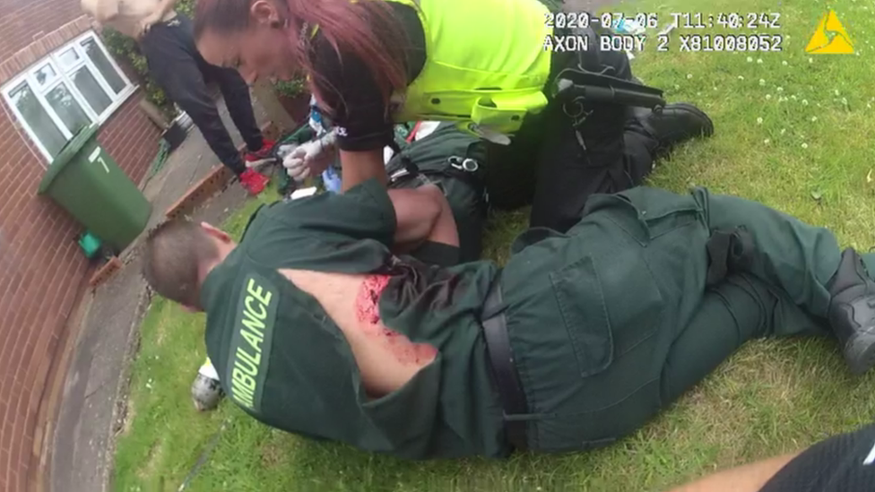 Police bodycam image of the paramedics being treated