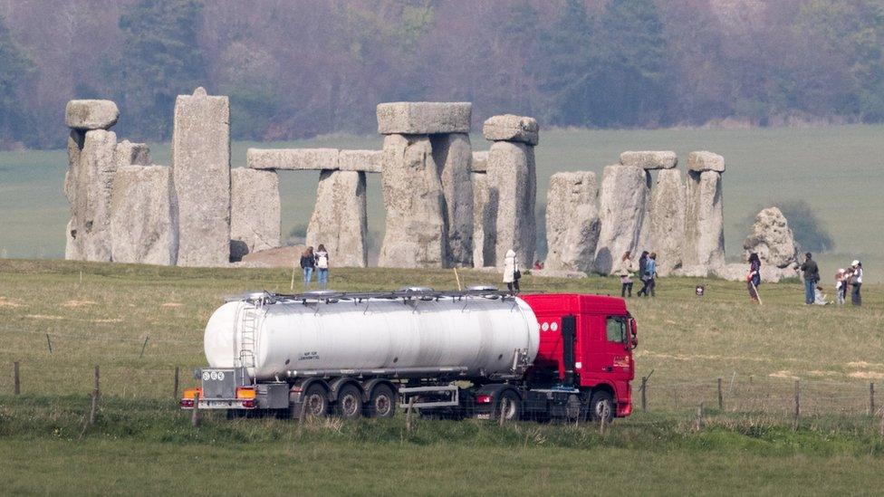 Lorry driving past Stonehenge.