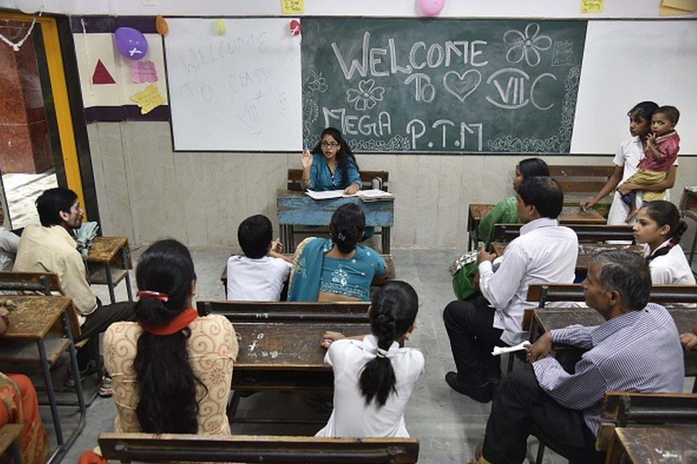 Government teachers interact with parents of school students during a Parent-Teacher Meeting (PTM) at Veer Savarkar Govt. Sarvodaya Kanya Vidyalaya at Kalkaji, as part of the Delhi state government's initiative to make parents of government schools students "stakeholders" in their children's education, on July 30, 2016 in New Delhi, India