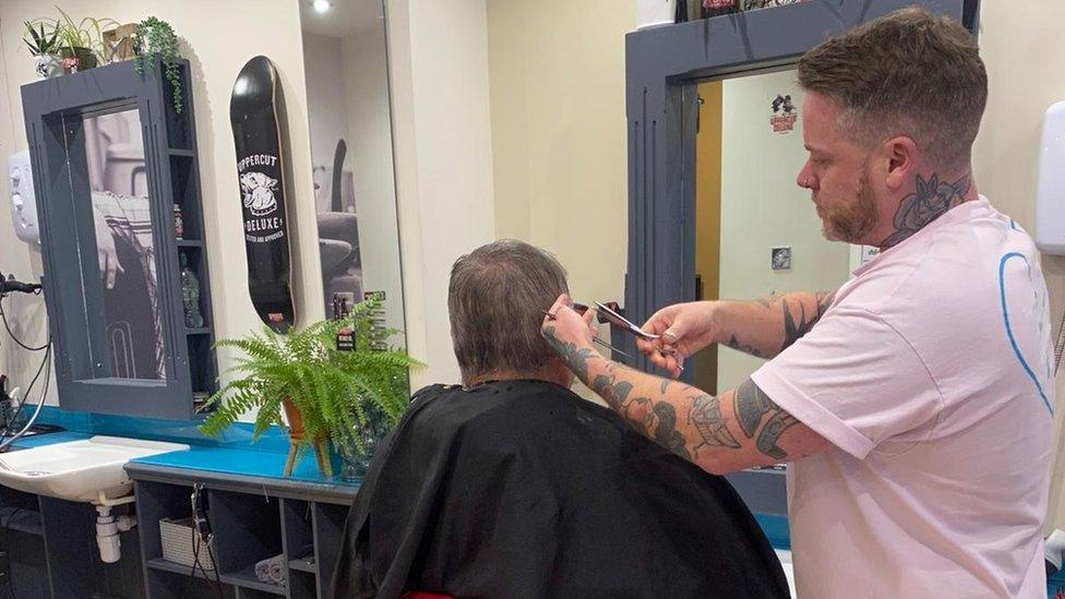 Kyle having his hair cut at the Croppers in Norwich