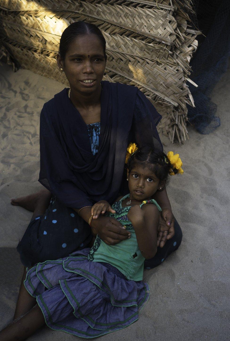 Amudha with her five-year-old daughter.